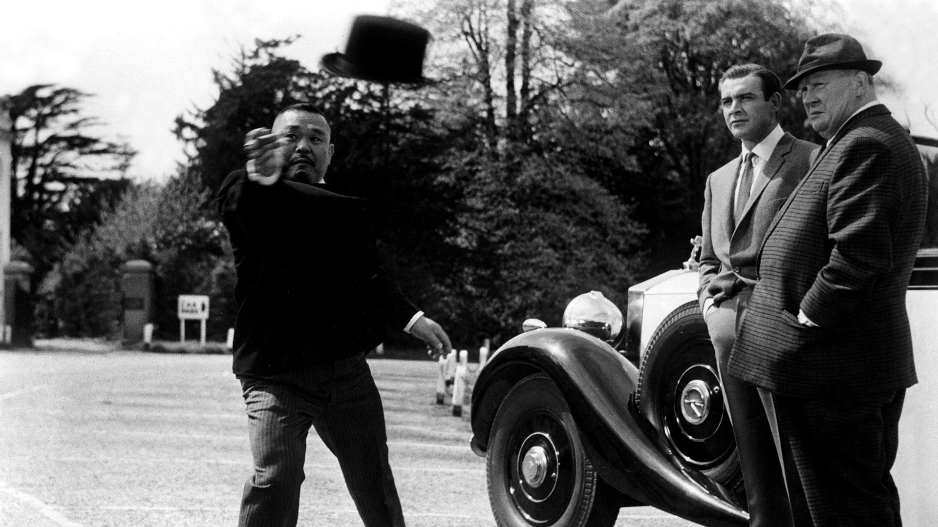 Harold Sakata, Sean Connery, Gert Frobe in "Goldfinger."